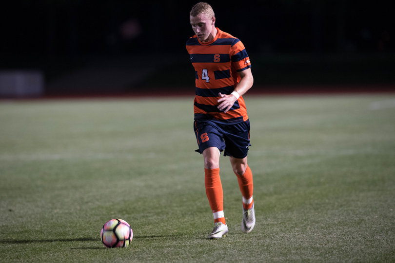 Liam Callahan dribbles the ball down field.