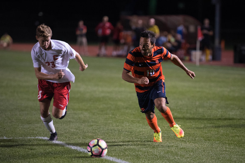 SU midfielder Sergio Camargo makes a run with the ball forward into a dangerous area in the box.