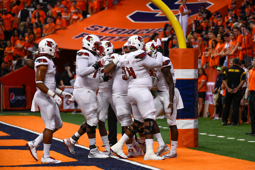 Louisville celebrates it's early score in what would be an offensive blitz. 