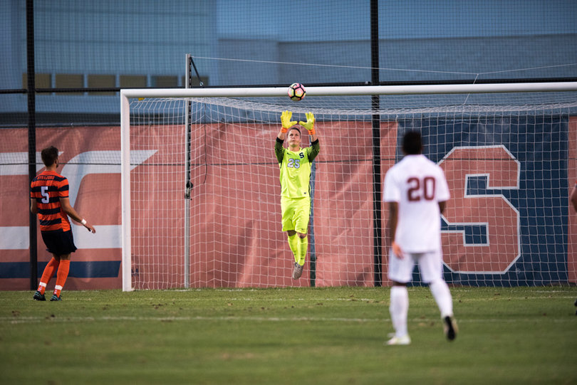 Goalie Hendrik Hilpert jumps up to catch an easy save. 