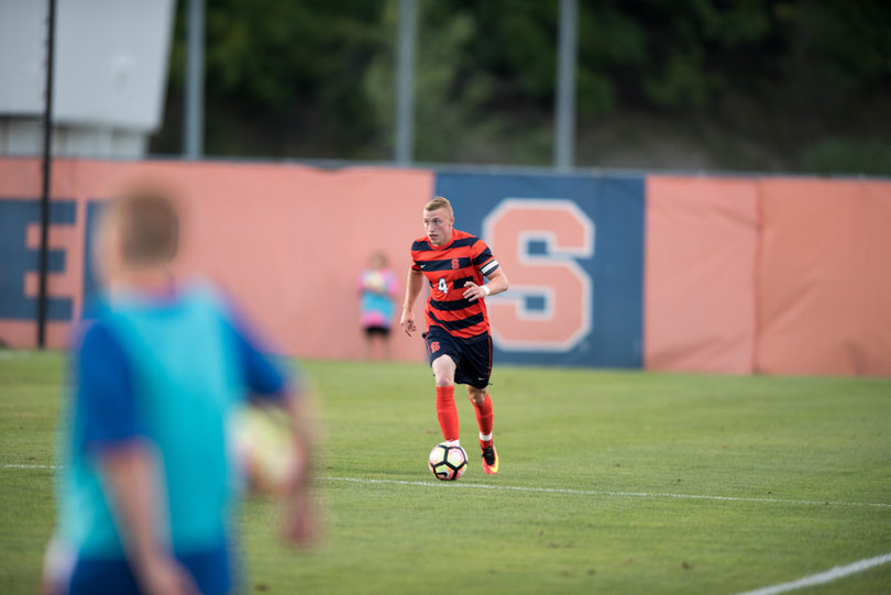 Redshirt senior captain Liam Callahan brings up the ball in Thursday night's game. 