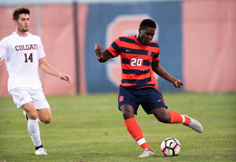 Sophomore defender Kamal Miller wins the ball and clears it.