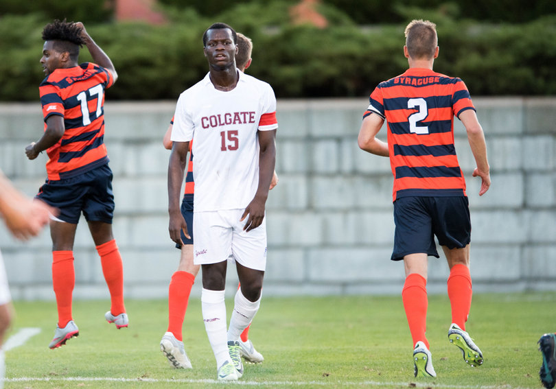 Colgate senior defender Zach Tamen turns away in disappointment as Nanco celebrates. 