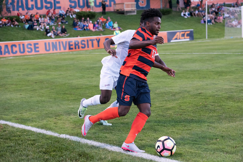 Nanco tiptoes his way along the sideline as he tries to keep the ball in play.