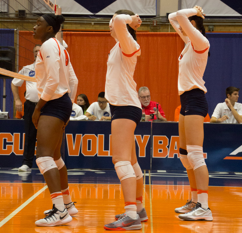 Syracuse's players stand in line while waiting for play to resume.