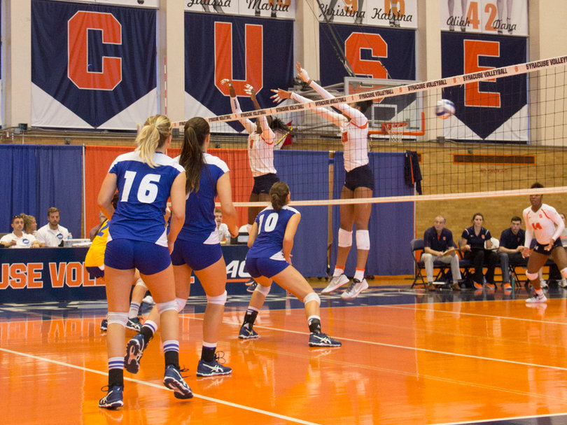 The Orange go up to try and block the 