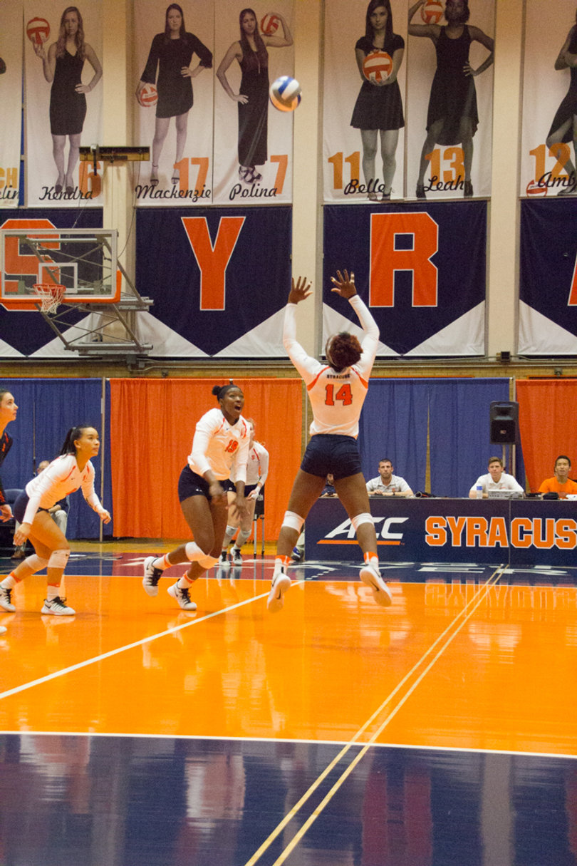 Jalissa Trotter (14) sets up a teammate to attack the ball.
