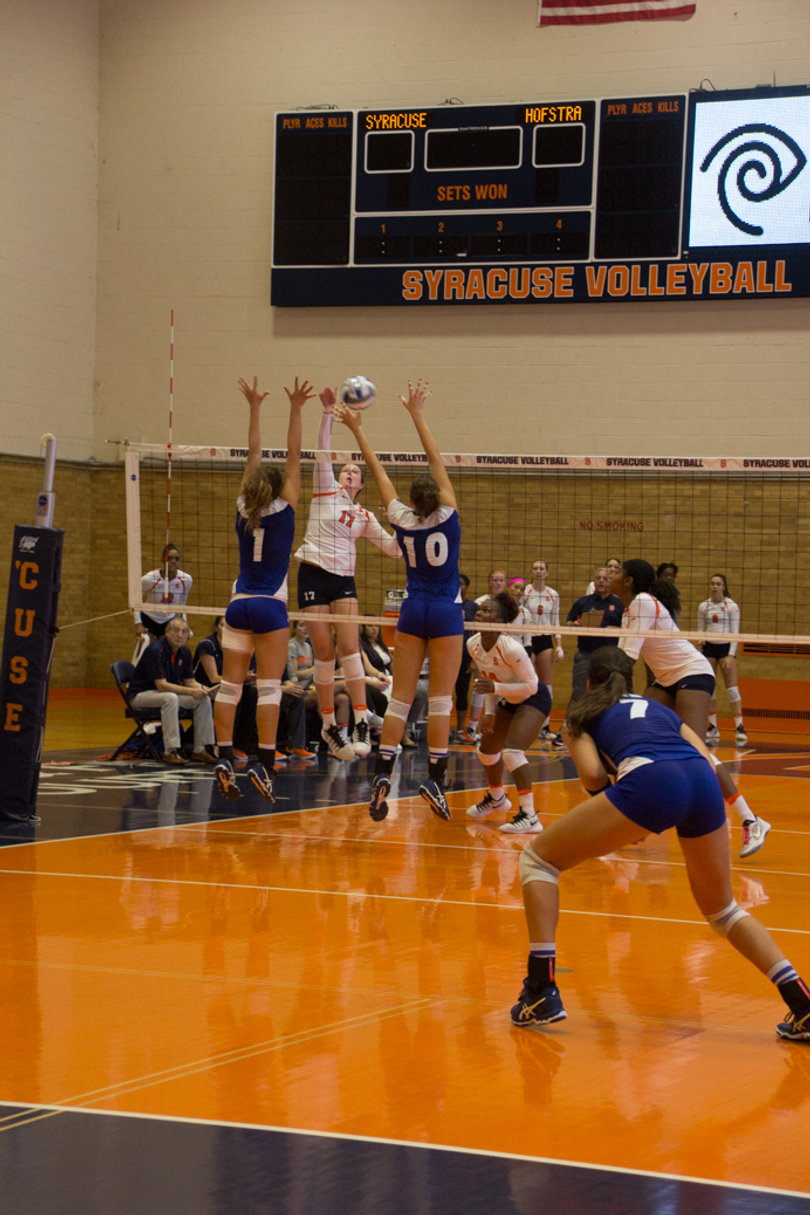 Weaver manages to sneak a ball past a Hofstra player. 