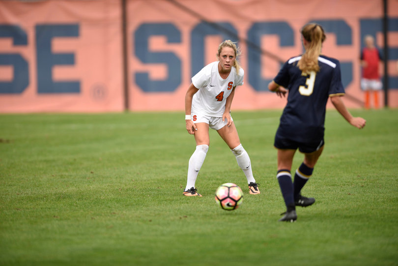 Eva Gordon stares down Natalie Ward as the Notre Dame midfielder approaches with the ball. 