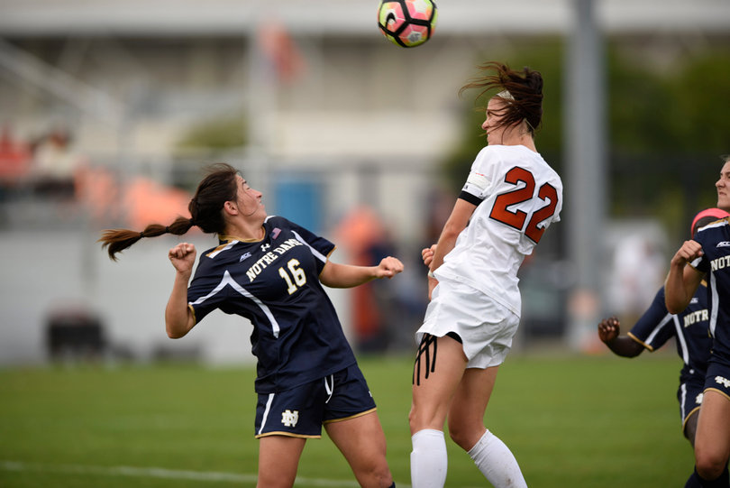Stephanie Skilton and Sandra Yu battle for a header.