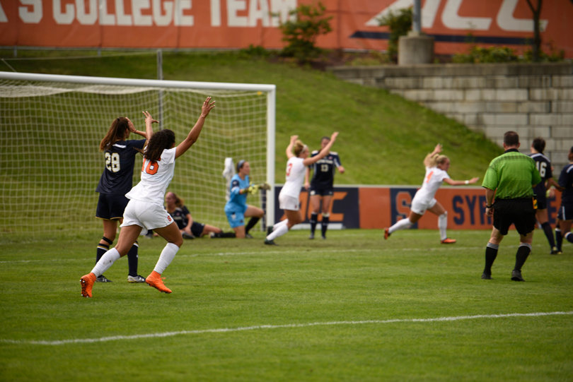 Orange players run toward Eva Gordon, whose goal gave Syracuse a 1-0 lead over No. 20 Notre Dame in the 33rd minute.