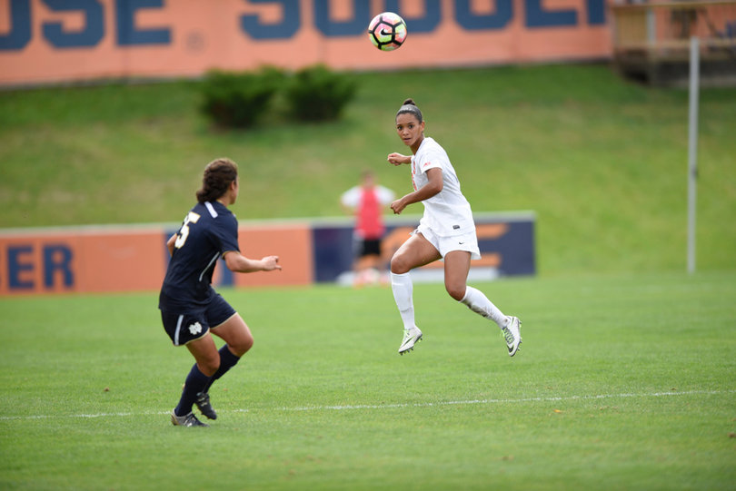 Syracuse's Alana O'Neill heads a ball past a Notre Dame defender. O'Neill was involved in a scuffle with a UND player during the game. 