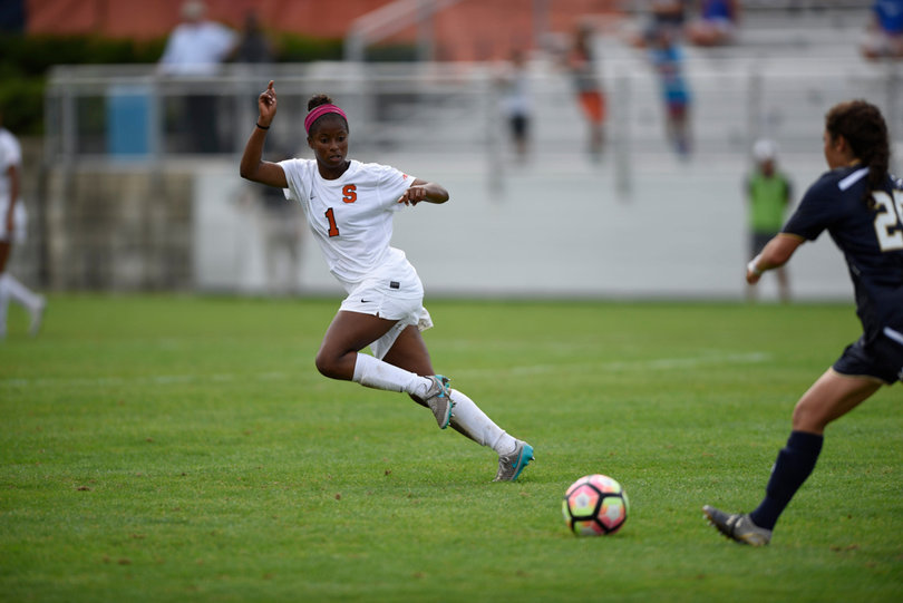 Sheridan Street retreats downfield as a Notre Dame attacker advances the ball forward.