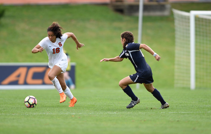 SU's Alex Lamontagne cuts to her right to get past a Notre Dame defender.