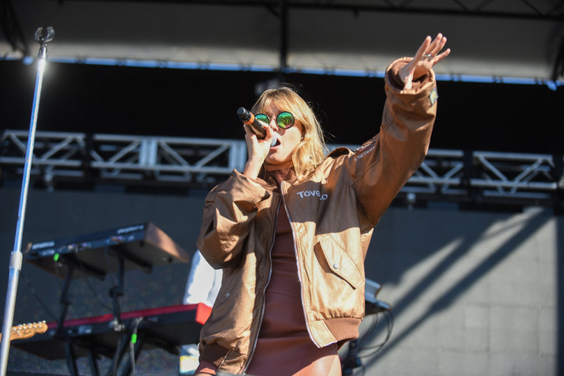 Tove Lo directs the crowd with her hand motions during her set. 