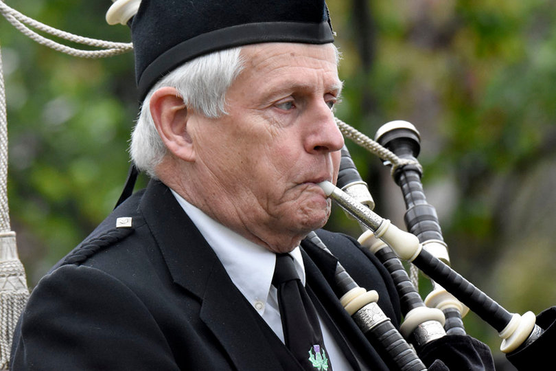 Bagpiper Avery Head plays "Flowers of Scotland," at the end of the ceremony. 