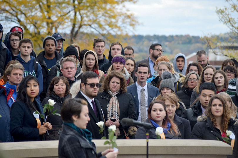The crowd watches as Brenner reads a small speech for Pamela Herbert.
