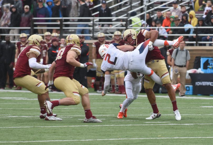 Dungey gets slammed by a Boston College defender.