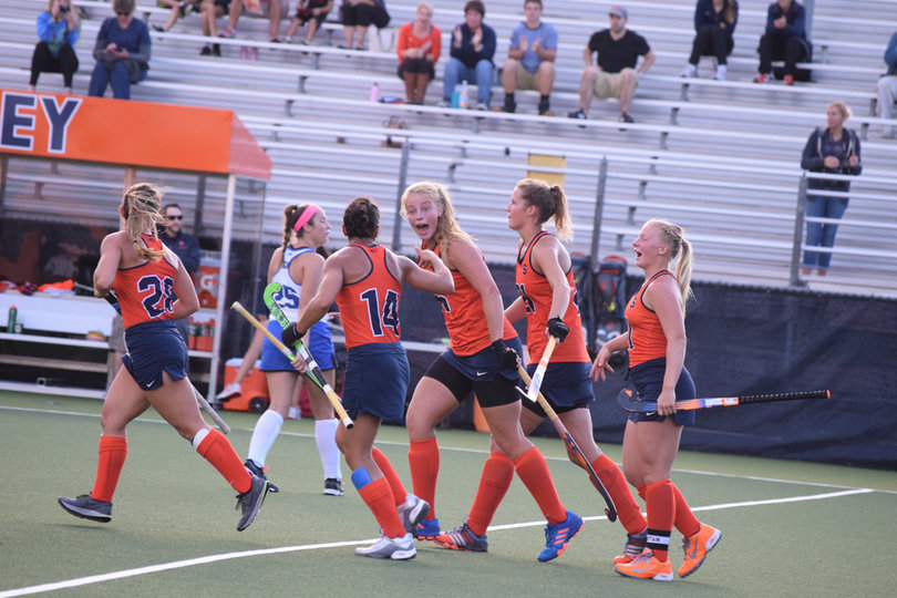 The Orange celebrating after scoring a goal. The five goals was tied for second-most scored by the team this season. 