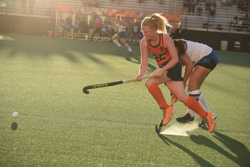 Carey runs away with the ball. 