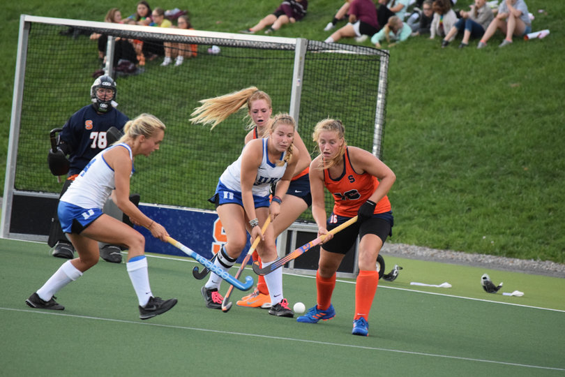The Orange and Blue Devils scrum for the ball. The Orange scored a goal off a scrum later in the game. 