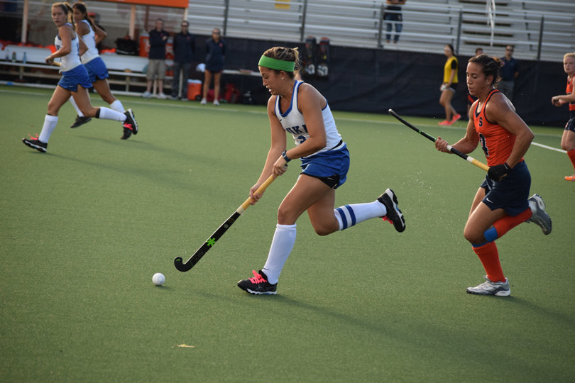 A Duke player tries to run ahead of the Orange deense. 