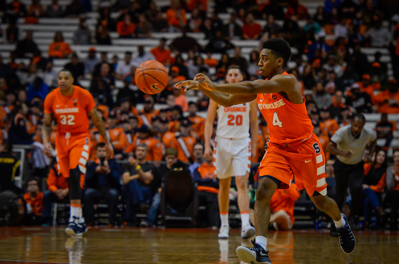 John Gillon passes up court.