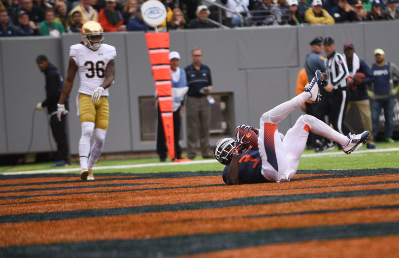 Ervin Philips tumbles into the end zone while catching a pass for a 14-yard score.