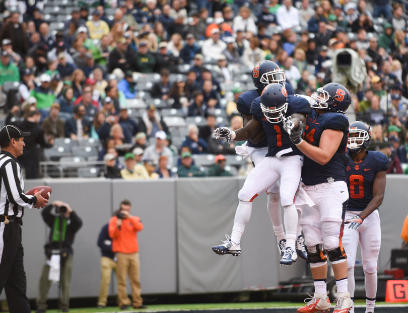 Syracuse receiver Brisly Estime (1) celebrates with his teammates after an SU score. He finished with four catches for 18 yards.