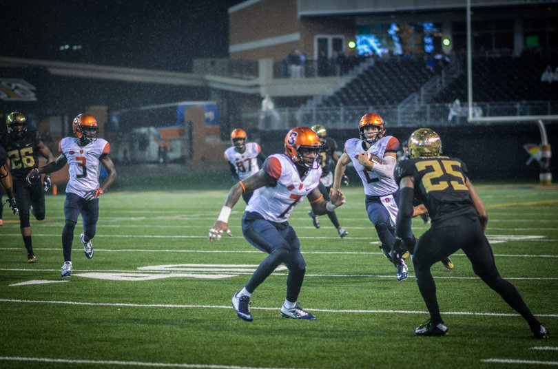 Dungey rolls out as Etta-Tawo sets up to block.