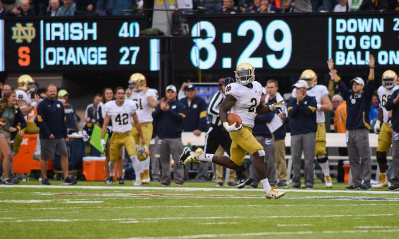 Notre Dame running back Dexter Williams looks around to see no Syracuse defenders near him in the middle of the 59-yard touchdown run.