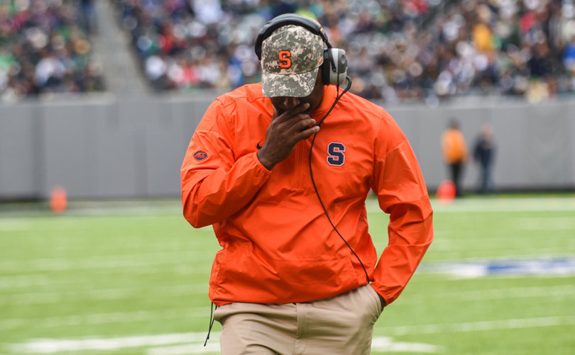 Syracuse head coach Dino Babers walks along the sideline with his hand over his mouth. His team lost to Notre Dame, 50-33, for its third 17-plus point defeat of the season.