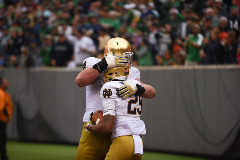 Notre Dame receiver Kevin Stepherson embraces a teammates after his only catch of the game — a 54-yard score.