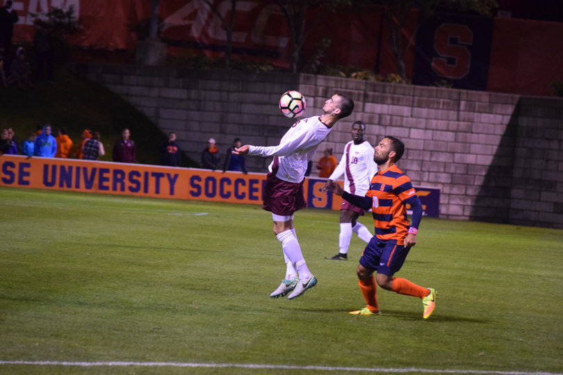 SU's Sergio Camargo defends a VT player closely. Camargo scored his first goal of the season to give the Orange the 1-0 win.
