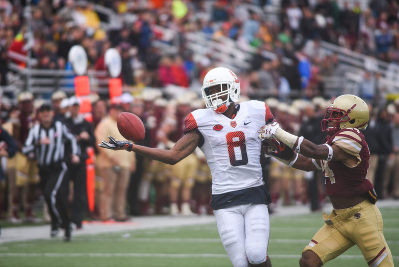 Ishmael extends his right arm out to try and make a one-handed grab.