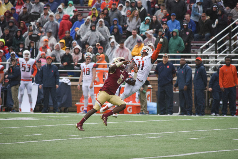 Syracuse cornerback Corey Winfield (11) extends his left arm to make a play on the ball.