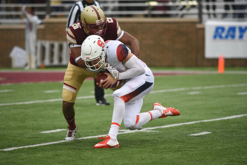 Syracuse quarterback Dungey gets taken down by Sharrieff Grice.