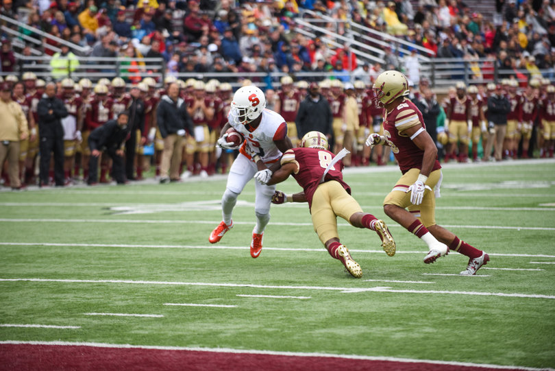 Philips avoids a tackle from Harris. He had 73 receiving yards on the day.
