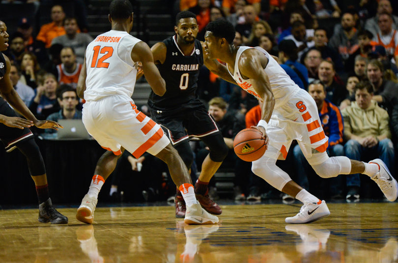 White navigates around a pick set by Taurean Thompson. White was 3-for-9 from the field.