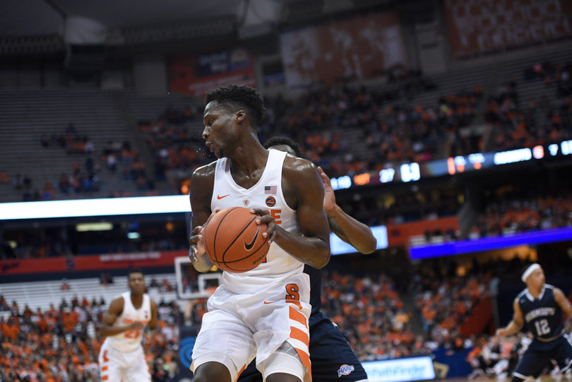 Tyler Roberson backs down a Hawks defender. Roberson grabbed four rebounds and had six points.