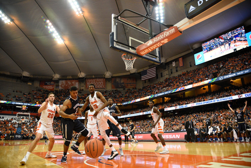 A loose ball carries out of bounds as Paschal Chukwu (13), Tyler Lydon (20) and others look on.