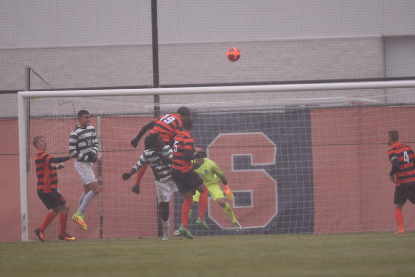 The ACC's Defensive Player of the Year, Miles Robinson (19), rises up for a header inside the SU box.
