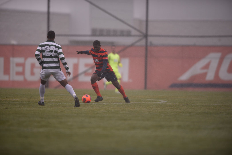 Syracuse's Kamal Miller looks to get by Devin Pierre. Miller helped a defense that recorded another shutout on Sunday.