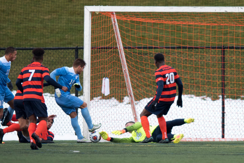 Hilpert dives on the ground as the Tar Heels pressure inside the box.