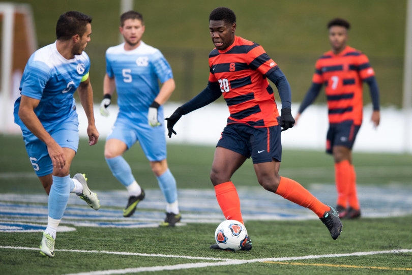 Miller dribbles the ball down the field.