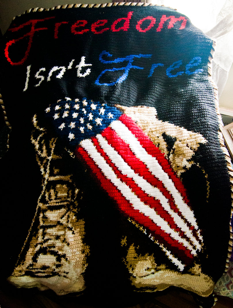 Deborah Mazzole was inspired by Bailey to work on portrait blankets like this military-inspired blanket Bailey made.