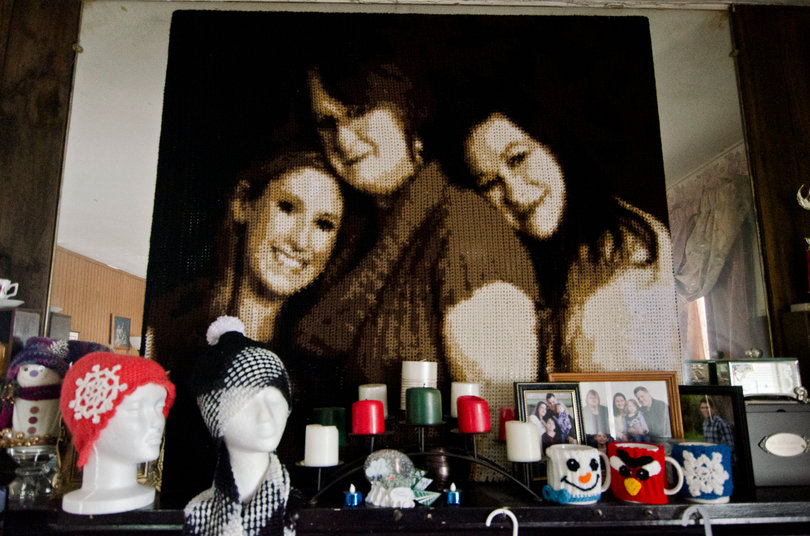 Bailey also made a blanket of her and her daughters. It now sits above her fireplace.