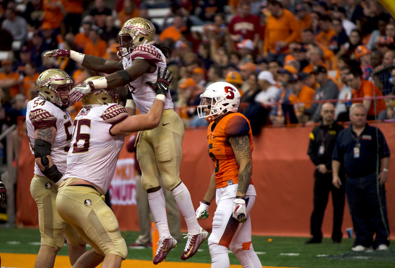 Rodney Williams walks away as Cook and his FSU teammates celebrate.