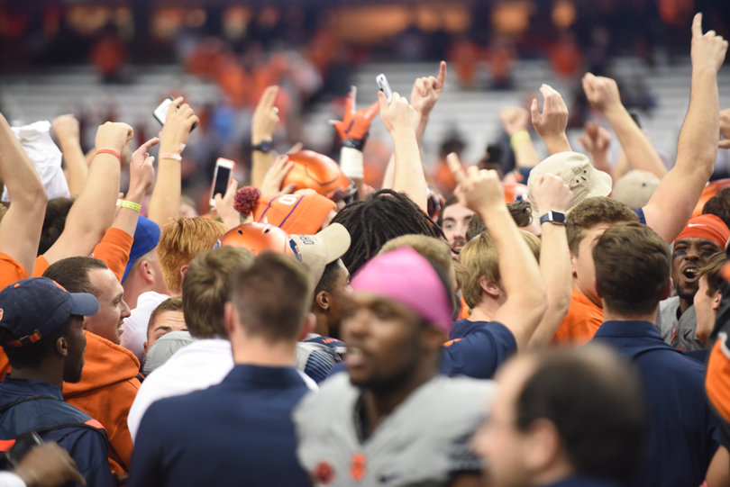 SU fans stormed the field after the Orange upset then-No. 17 Virginia Tech, 31-17. The Orange beat a ranked opponent for the first time since 2012.