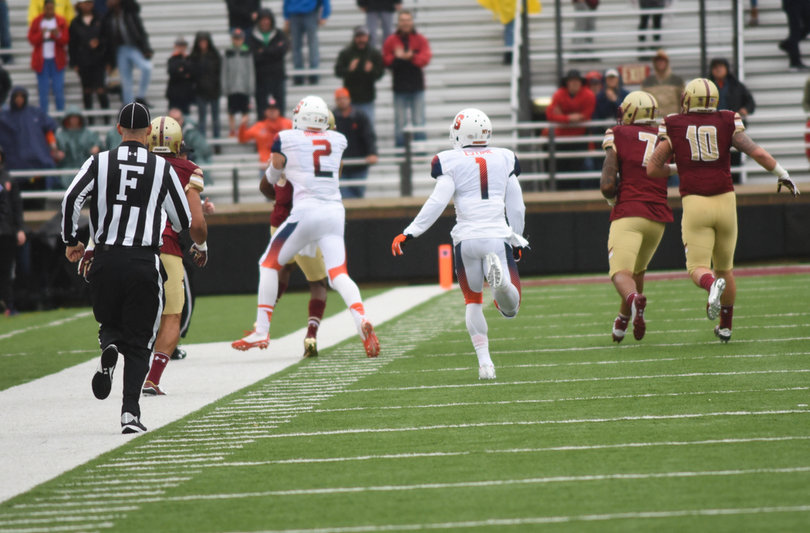 Eric Dungey (2) threw a Boston College player to the ground late out of bounds after an interception, then shoved another player. In the scuffle, SU director of football operations Brad Wittke shoved a BC player.